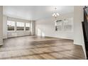 Spacious living room with large windows offering ample natural light and views at 39731 Congress Ln, Elizabeth, CO 80107