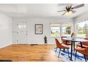 Bright dining room with hardwood floors, a ceiling fan, and modern decor at 951 S Osage St, Denver, CO 80223