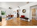 Bright living room features hardwood floors, a modern dining set, and a stylish bench at 951 S Osage St, Denver, CO 80223