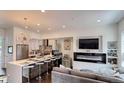 Modern kitchen with a large island, stainless steel appliances, and an open layout connecting to the cozy living area at 3030 Wilson Ct # 5, Denver, CO 80205