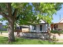 Charming home with a well-maintained front yard and inviting curb appeal, including mature tree coverage at 3817 Osage St, Denver, CO 80211