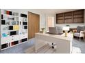 Bright home office with ample storage, desk and comfortable chair at 3693 E Costilla Ave, Centennial, CO 80122