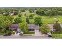 This home boasts an ideal location near the golf course with lush green views at 8397 Chase Dr, Arvada, CO 80003