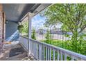 Covered front porch with views of the neighborhood at 433 N 15Th Ave, Brighton, CO 80601