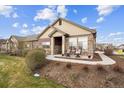 Inviting single-story home showcasing stone details, a covered front porch, and neat landscaping at 12564 Madison Way, Thornton, CO 80241
