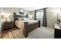 Comfortable main bedroom featuring a large bed, neutral tones, and soft natural light from the window at 10842 W Evans Ave # 34, Lakewood, CO 80227