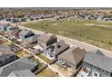 Areal view of neighborhood showing houses with fenced yards, and a green space in the center at 6912 Poudre St, Frederick, CO 80530