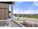 Scenic view from porch overlooking a peaceful neighborhood and the rocky mountains in the distance at 6912 Poudre St, Frederick, CO 80530