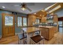 Bright kitchen featuring custom wood cabinets, granite countertops, stainless steel appliances and eat-in table at 207 County Road 65, Evergreen, CO 80439