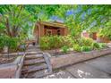 Charming brick home with mature landscaping and stone retaining wall at 3044 W 40Th Ave, Denver, CO 80211