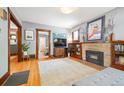 Inviting living room with fireplace, hardwood floors, and natural light at 3044 W 40Th Ave, Denver, CO 80211