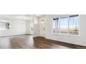 Bright dining room with hardwood floors and large windows at 693 N Tempe St, Aurora, CO 80018