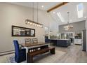 Elegant dining room featuring high ceilings, modern lighting, and an open concept layout at 2539 Lake Meadow Dr, Lafayette, CO 80026