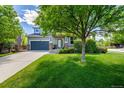 Two-story home boasting a well-manicured lawn and a charming covered front porch at 902 Jarvis Dr, Erie, CO 80516