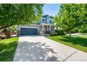 Attractive two-story home with a spacious driveway and a welcoming covered porch at 902 Jarvis Dr, Erie, CO 80516