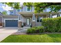 Charming front exterior of a home with a covered porch and well-maintained landscaping at 902 Jarvis Dr, Erie, CO 80516