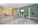 Bright living room with carpet floors and a view into the connected dining room at 1029 E 8Th Ave # 901, Denver, CO 80218