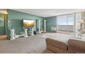 Spacious living room with a sliding glass door to a balcony, creating a relaxing area with plenty of natural light at 1029 E 8Th Ave # 901, Denver, CO 80218