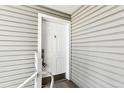 Exterior view of the property's white front door with an adjacent white wall at 18302 E Kepner Pl # 207, Aurora, CO 80017