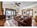 Open-concept living room with a sliding door that leads to a wintery outdoor patio at 680 S Main St # 18, Breckenridge, CO 80424