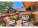 Inviting outdoor patio featuring comfortable seating, a decorative fountain, and a colorful flower display at 4901 W 103Rd Cir, Westminster, CO 80031