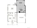 Open-concept floor plan with gourmet kitchen, great room, flex room, and two-car garage on the main level at 661 Split Rock Dr, Erie, CO 80516