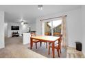 Bright dining area with a sliding glass door that provides backyard access at 23317 E Saratoga Cir, Aurora, CO 80016