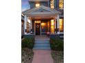 Inviting covered front porch with charming architectural details and decorative wreath at 713 S Washington St, Denver, CO 80209