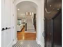 Grand foyer with decorative tile, hardwood floors, and an elegant staircase at 536 N Williams St, Denver, CO 80218