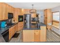 Bright kitchen featuring stainless steel appliances and ample cabinet space at 951 S Fulton St, Aurora, CO 80247