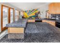 Beautiful kitchen with gray countertops and wood cabinets, and ample space at 951 S Fulton St, Aurora, CO 80247