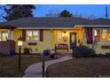 Close up of house number and front porch with bench and patriotic decorations at 3126 S Vine St, Englewood, CO 80113