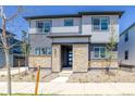 Charming two-story home with stone accents and manicured front yard landscaping at 23951 E 40Th Ave, Aurora, CO 80019