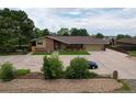 Ranch home with large driveway and expansive yard at 14121 Countryhills Dr, Brighton, CO 80601