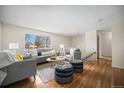 Inviting living room with a large window, hardwood floors, and stylish decor creating a cozy atmosphere at 1529 Ashcroft Dr, Longmont, CO 80501