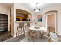 Kitchen with breakfast bar and dining area at 5255 Memphis St # 917, Denver, CO 80239