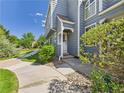 Charming home featuring a covered entryway and well-maintained landscaping, enhancing its curb appeal at 2007 S Balsam St, Lakewood, CO 80227