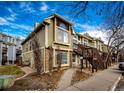 Townhome exterior, showing walkway and landscaping at 1885 S Quebec Way # 16, Denver, CO 80231