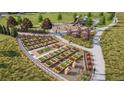 Aerial view of community garden with playground, trees, and walking path at 6562 Arbor Blvd # 2, Thornton, CO 80602