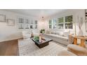 Bright living room with plush seating, plantation shutters, and contemporary design elements at 2090 Irving St, Denver, CO 80211