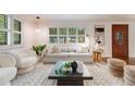 Cozy living room with large window, comfortable seating, and contemporary decor at 2090 Irving St, Denver, CO 80211