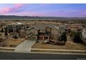 Expansive aerial view of the home showcasing its large lot and mountain views at 10795 Sundial Rim Rd, Highlands Ranch, CO 80126