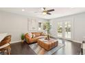Inviting living room with natural light, a comfortable leather sofa, and elegant decor at 2408 Irving St, Denver, CO 80211