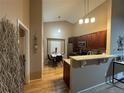 Well-lit kitchen featuring stainless steel appliances and an adjacent dining area at 6887 S Dover Way, Littleton, CO 80128