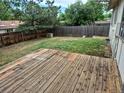Spacious wooden deck offering a perfect spot for outdoor gatherings at 2832 S Mobile St, Aurora, CO 80013
