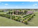 Aerial view showing expansive property, large house, detached garage, and manicured trees at 3519 Zane Gray Loop, Parker, CO 80138