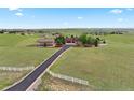 Exterior view of home with long driveway leading to large garage and beautiful green landscaping at 3519 Zane Gray Loop, Parker, CO 80138