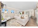 Bright living room with a comfortable sectional sofa, stylish decor, and an inviting atmosphere for relaxation at 3100 W 94Th Ave, Westminster, CO 80031
