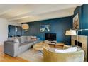 Comfortable living room with hardwood floors, stylish furnishings, and a fireplace perfect for relaxation at 200 N Pearl St # 404, Denver, CO 80203