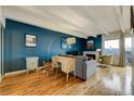 Living room with hardwood floors, large windows offering city views, and a comfortable sitting area at 200 N Pearl St # 404, Denver, CO 80203
